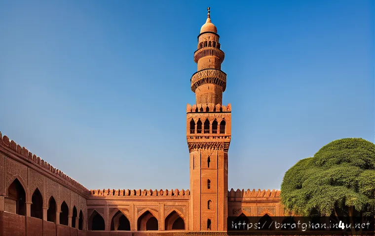 미나레트 오브 잠 유적지 - A towering 65-meter historic minaret crafted from local red bricks with intricate geometric mosaic p...